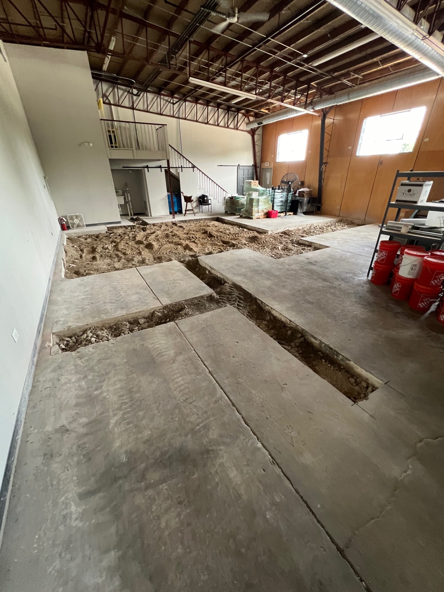 Trenches cut into the concrete floor during the renovation